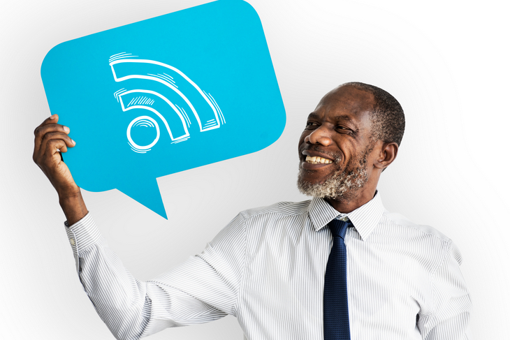 Happy man holding Wifi symbol